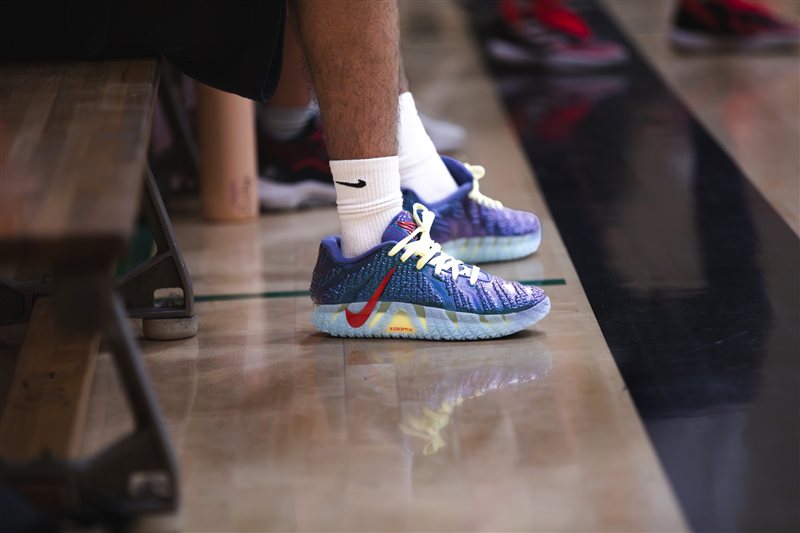 Close-up of colourful basketball shoes on a gym floor